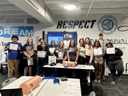 group photo of kids holding up their certificates of completion